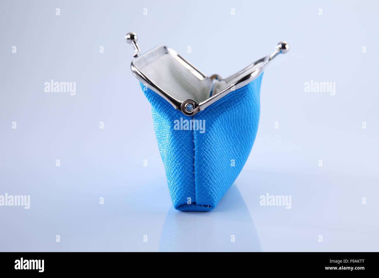 empty blue color purse on the white background Stock Photo - Alamy
