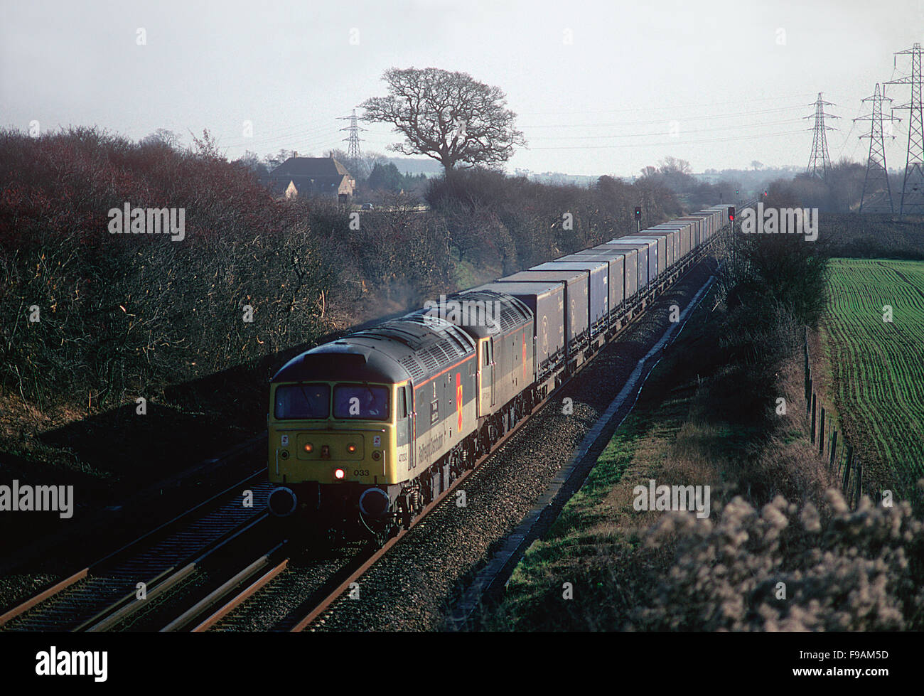 A pair of class 47 locomotives working the Ford company 'blue train' near Sellinge. 14th January 1996. Stock Photo
