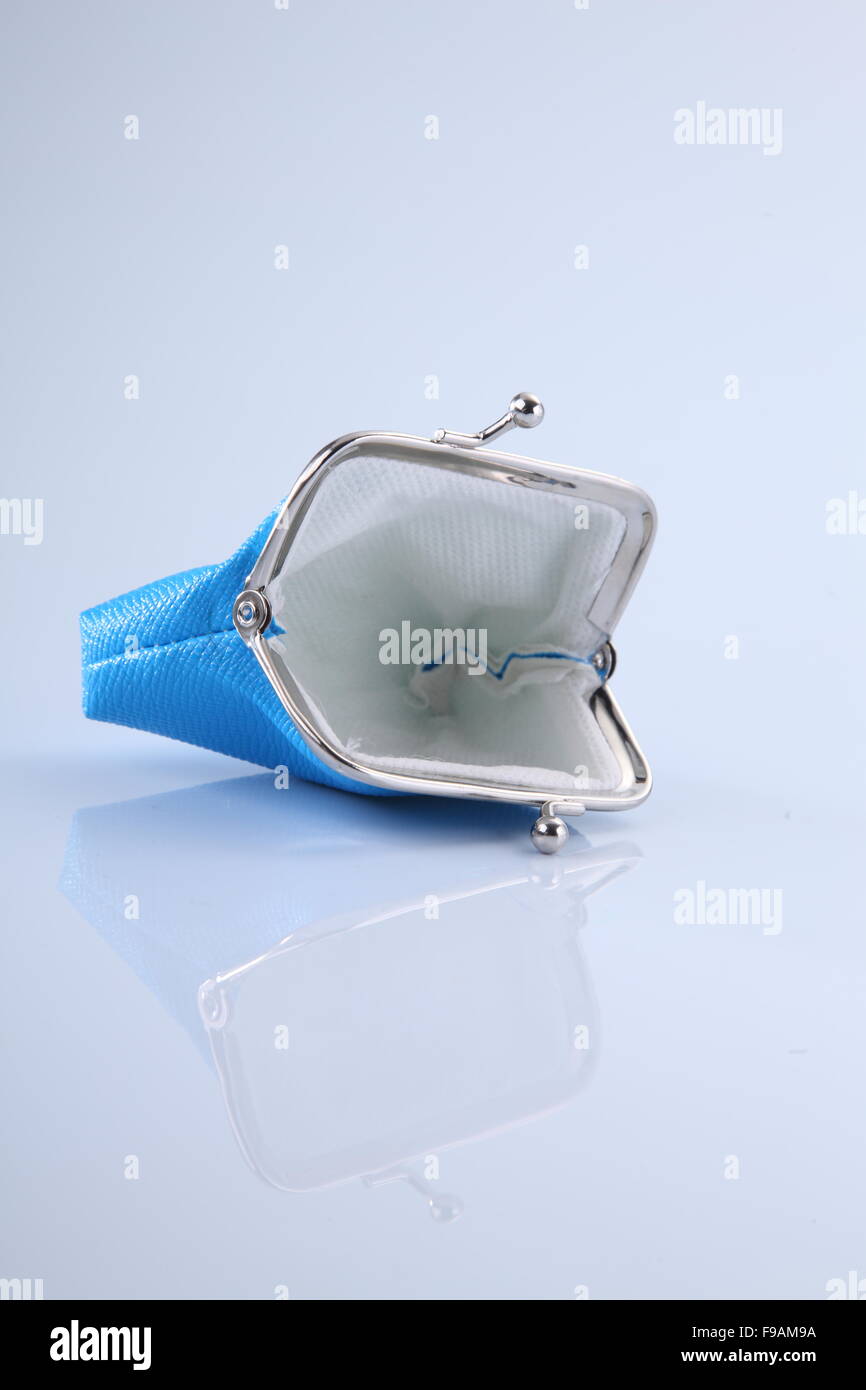 empty blue purse open on the white background Stock Photo - Alamy