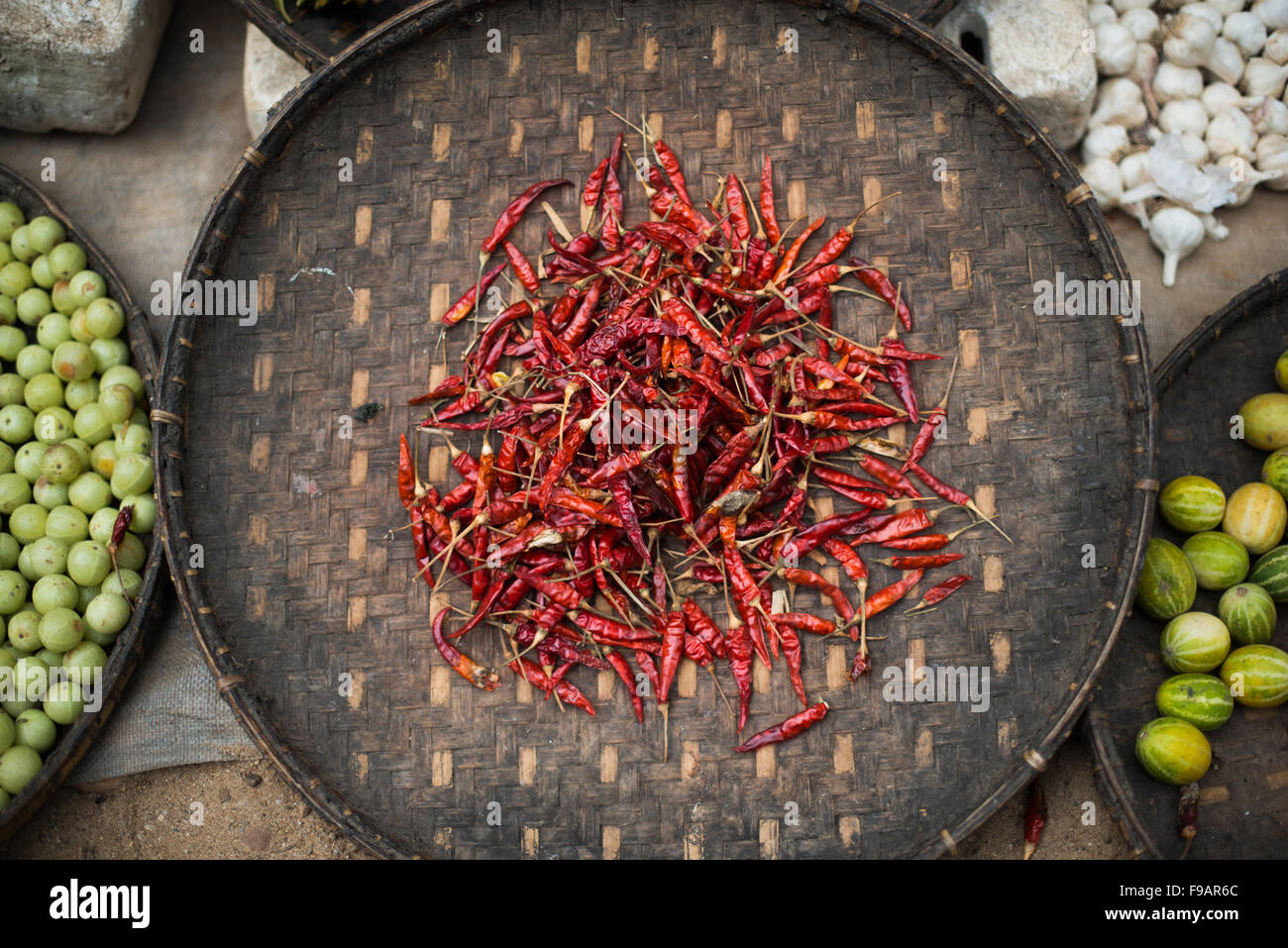 BAGAN, MYANMAR - Dried red chili peppers on a bamboo platter on displace at the morning market at Myinkaba Village. Myinkaba Village, a small local village that lies between Old Bagan and New Bagan in Myanmar. Stock Photo