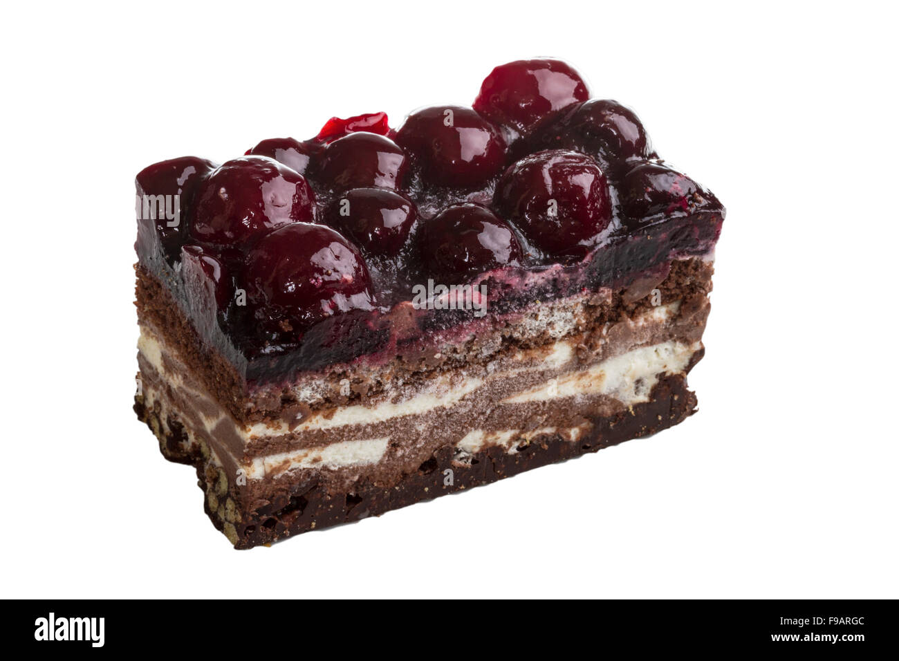 Chocolate cake with cherry on top on a white background Stock Photo - Alamy