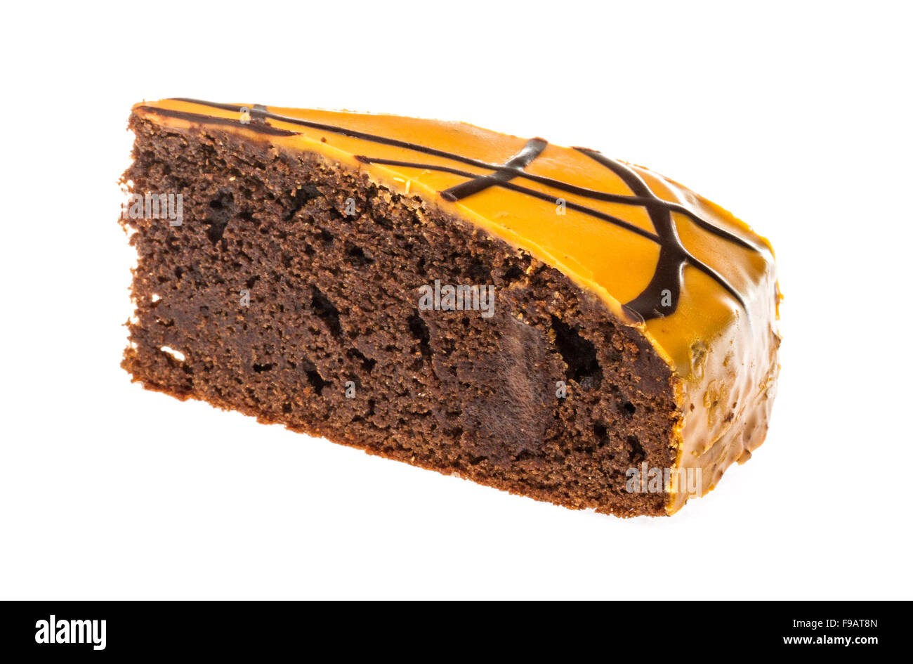 Piece of chocolate cake with icing on white isolated background Stock ...