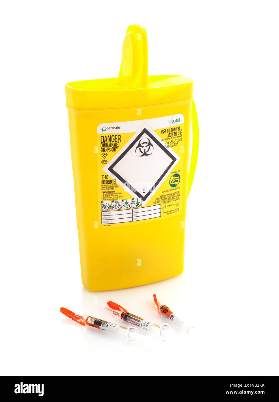 Yellow medical needle disposal waste Cut Out Stock Images & Pictures