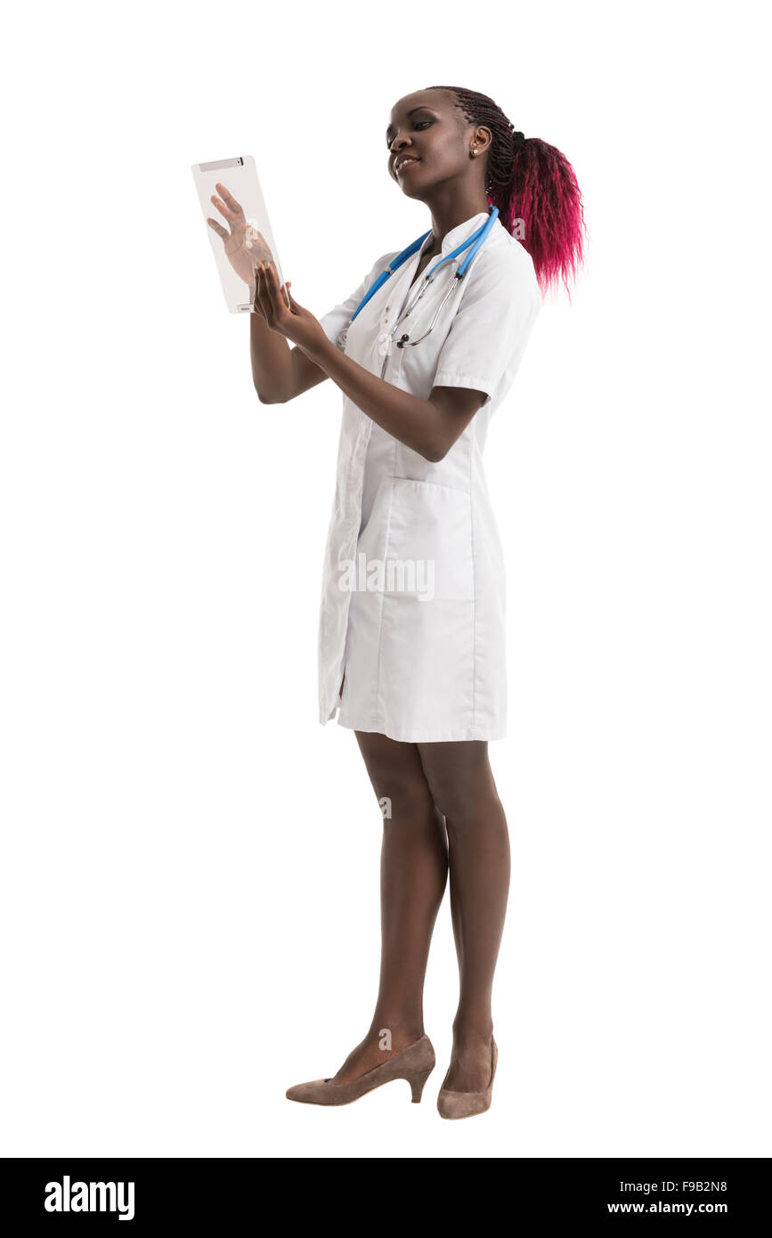 Smiling african doctor using a tablet computer on white background Stock Photo