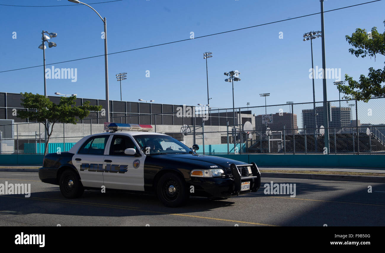 (151215) -- LOS ANGELES, Dec. 15, 2015 (Xinhua) -- A LAPD police car patrols outside the closed Contreras High School, in Los Angeles, the United States, on Dec. 15, 2015. All Los Angeles Unified School District (LAUSD) schools will stay closed today in response to a reported bomb threat, Schools Superintendent Ramon Cortines said. Police said the threat was called in to a School Board member. The threat is involving backpacks and packages left at campuses. The closures applied to all LAUSD campuses, around 900 of them. Los Angeles Unified School District is the second-largest school district Stock Photo