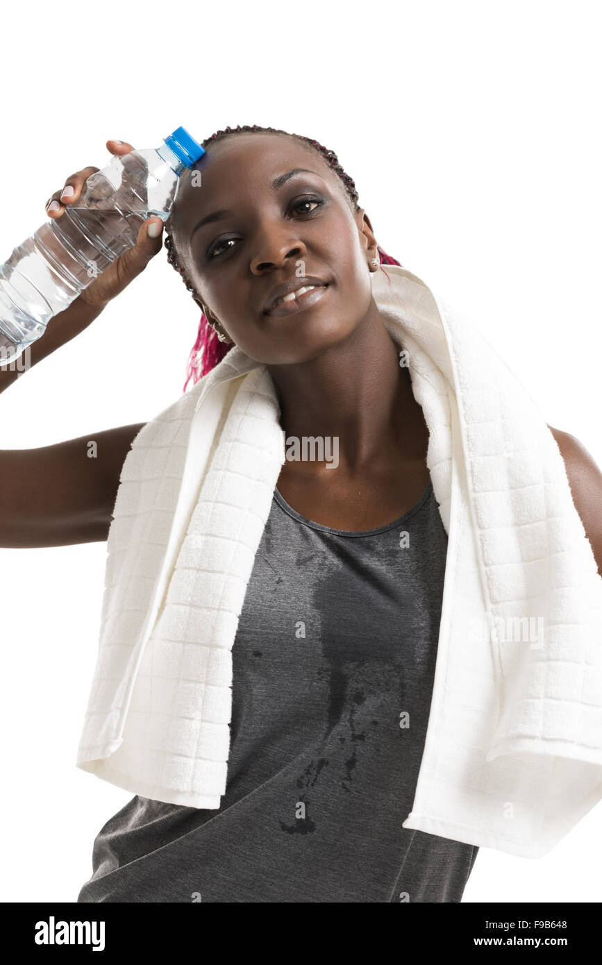 Athletic girl with a bottle of water and towel Stock Photo - Alamy