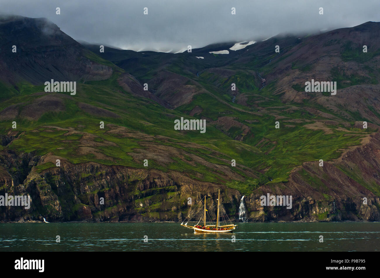 Whale watching tour from old sailing ship at Husavik bay area Stock ...