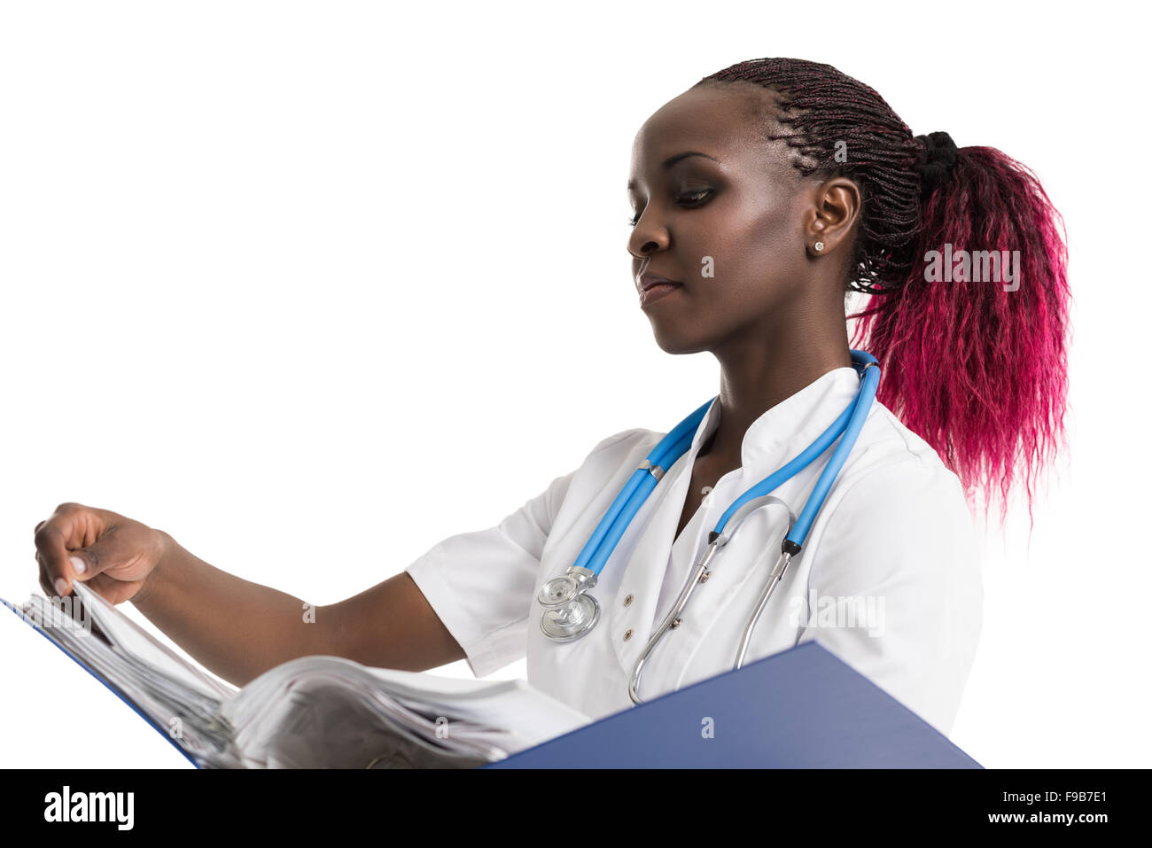 Portrait of confident young medical doctor holding medical records on white background Stock Photo