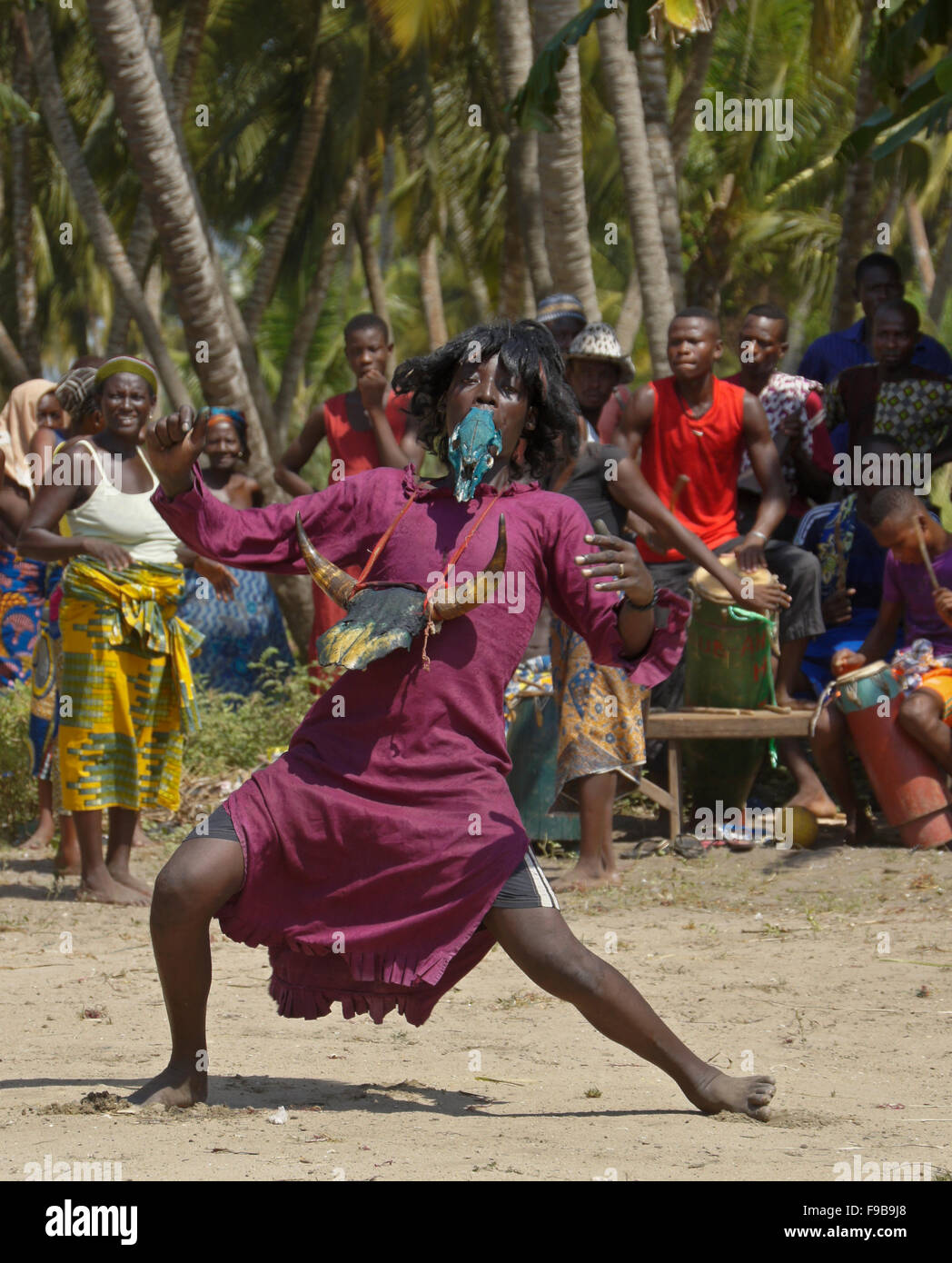Bewigged man dancing at Zangbeto ceremony in Heve-Grand Popo village, Benin Stock Photo