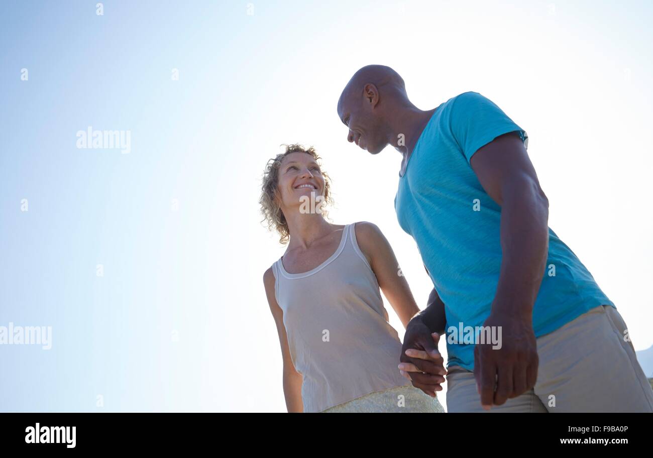 Couple holding hands on the beach hi-res stock photography and images ...