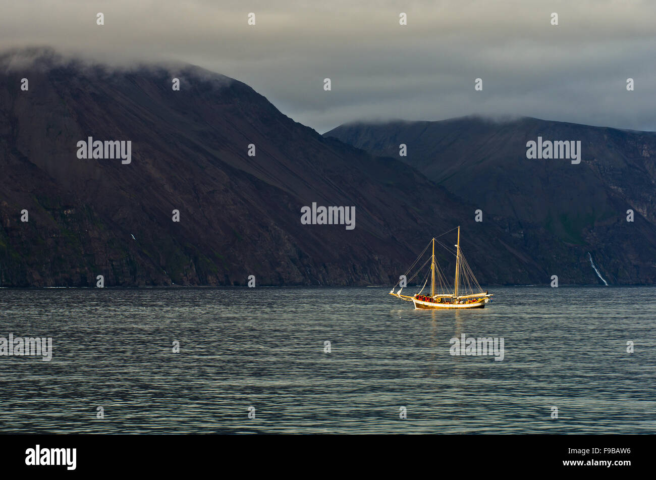 Whale watching tour from old sailing ship at Husavik bay area Stock ...