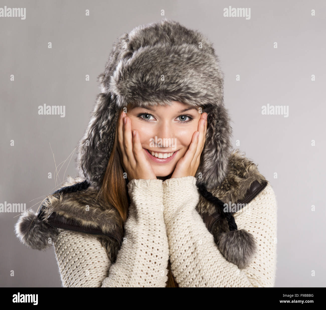 Beautiful woman wearing sweater is posing in studio, winter fashion Stock Photo Alamy