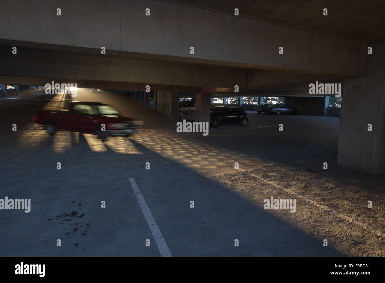 car blurring by in a parking structure Stock Photo