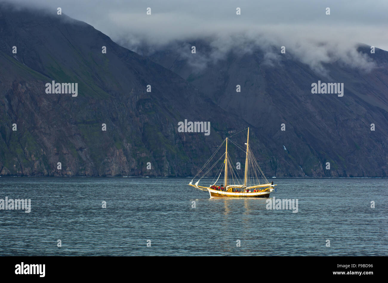 Whale watching tour from old sailing ship at Husavik bay area Stock ...