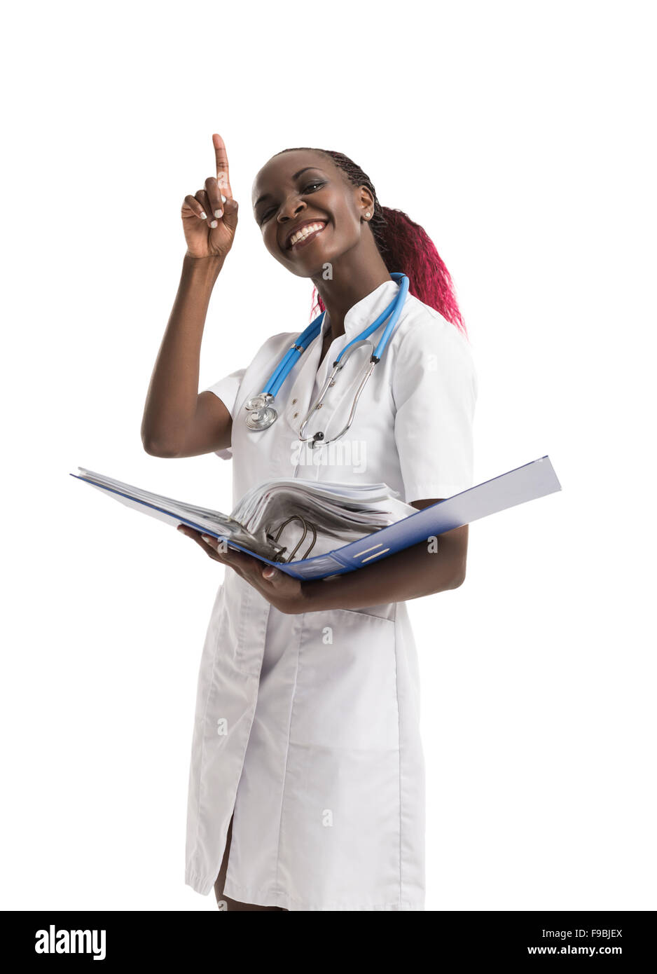 Portrait of confident young medical doctor holding medical records on white background Stock Photo