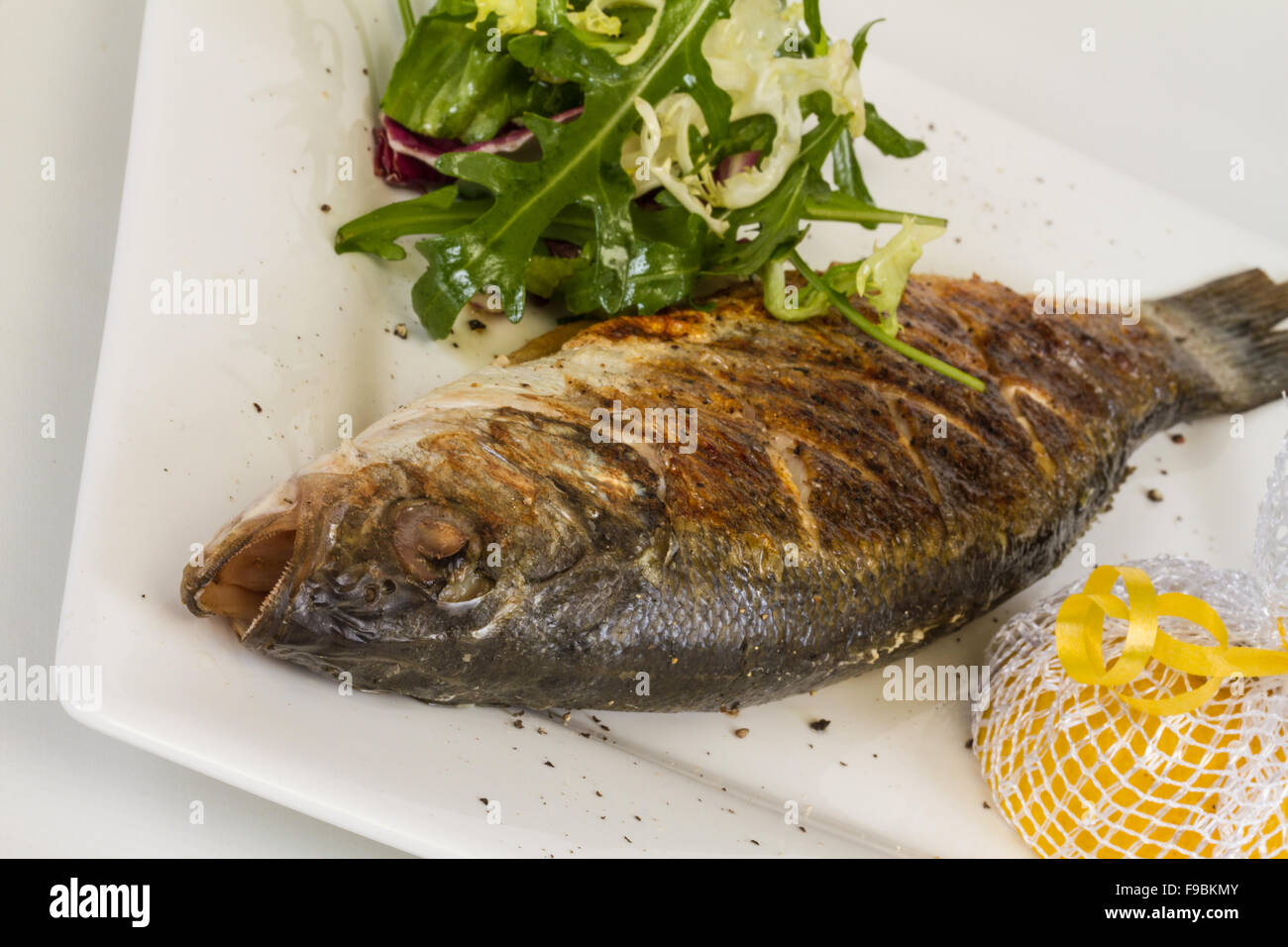 Seabass with vegetables Stock Photo Alamy