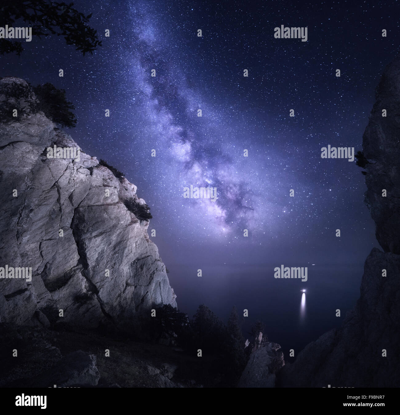 Milky Way. Beautiful night landscape with rocks, sea and starry sky. Nature Background Stock Photo