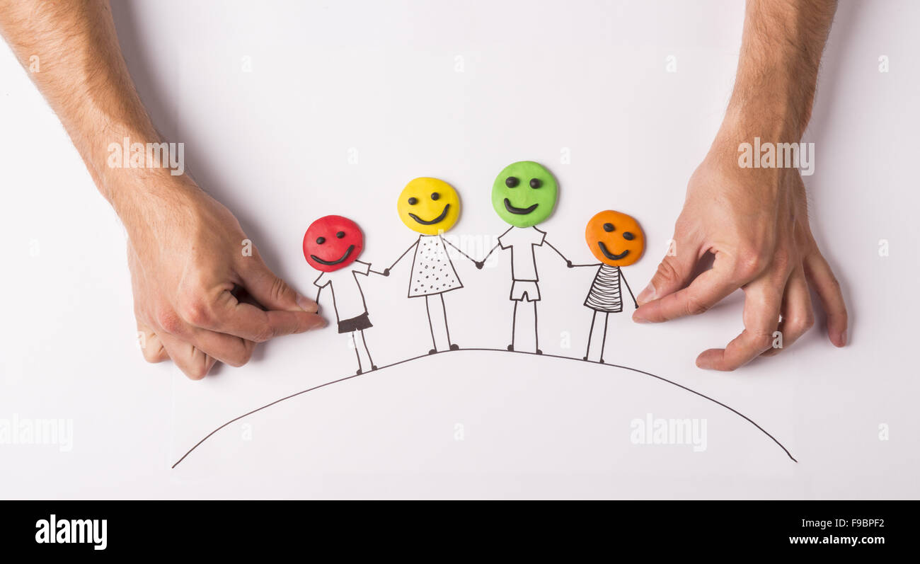 Happy family concept with heads from play dough Stock Photo