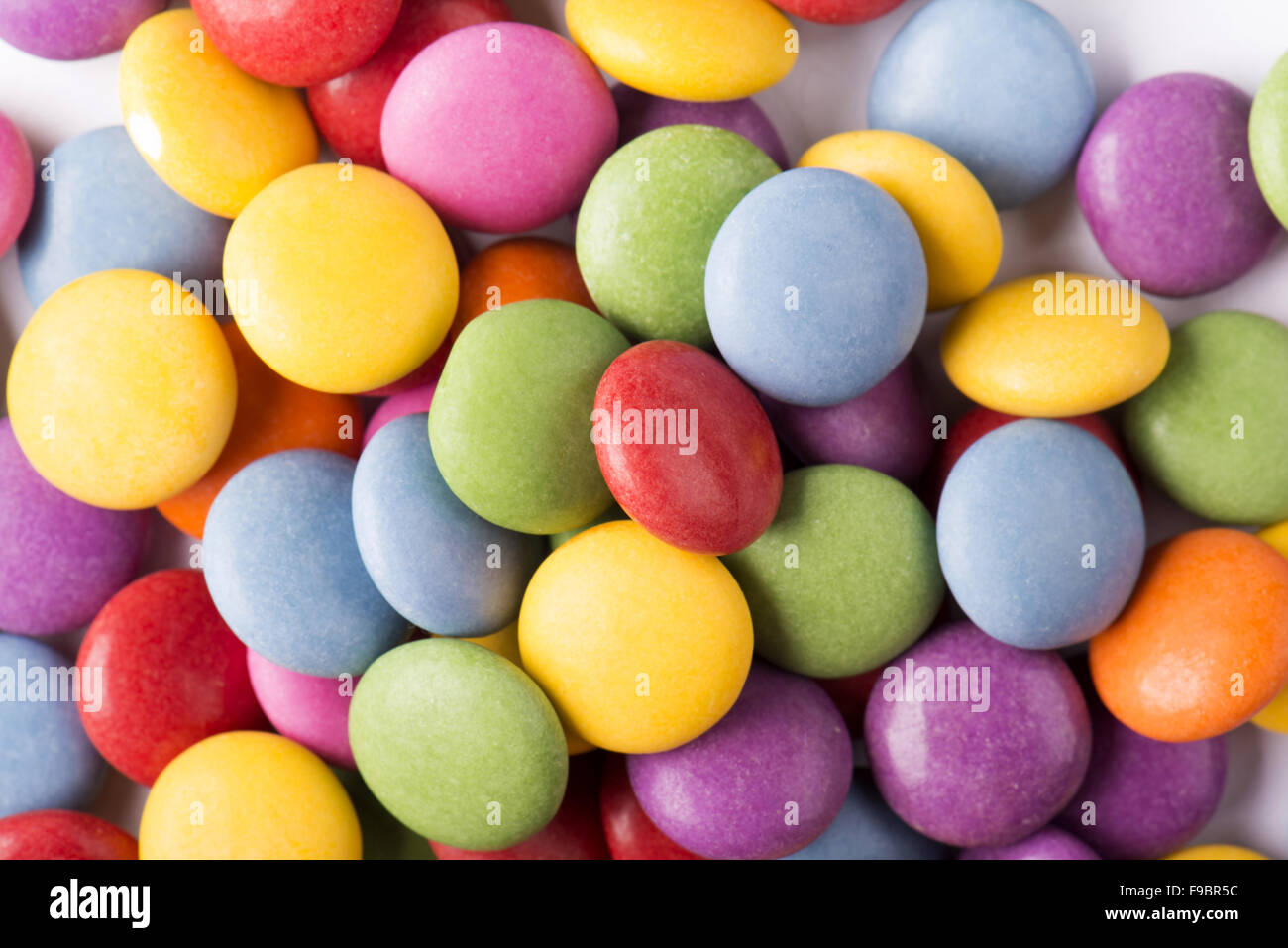 Colorful button shaped candies hi-res stock photography and images - Alamy