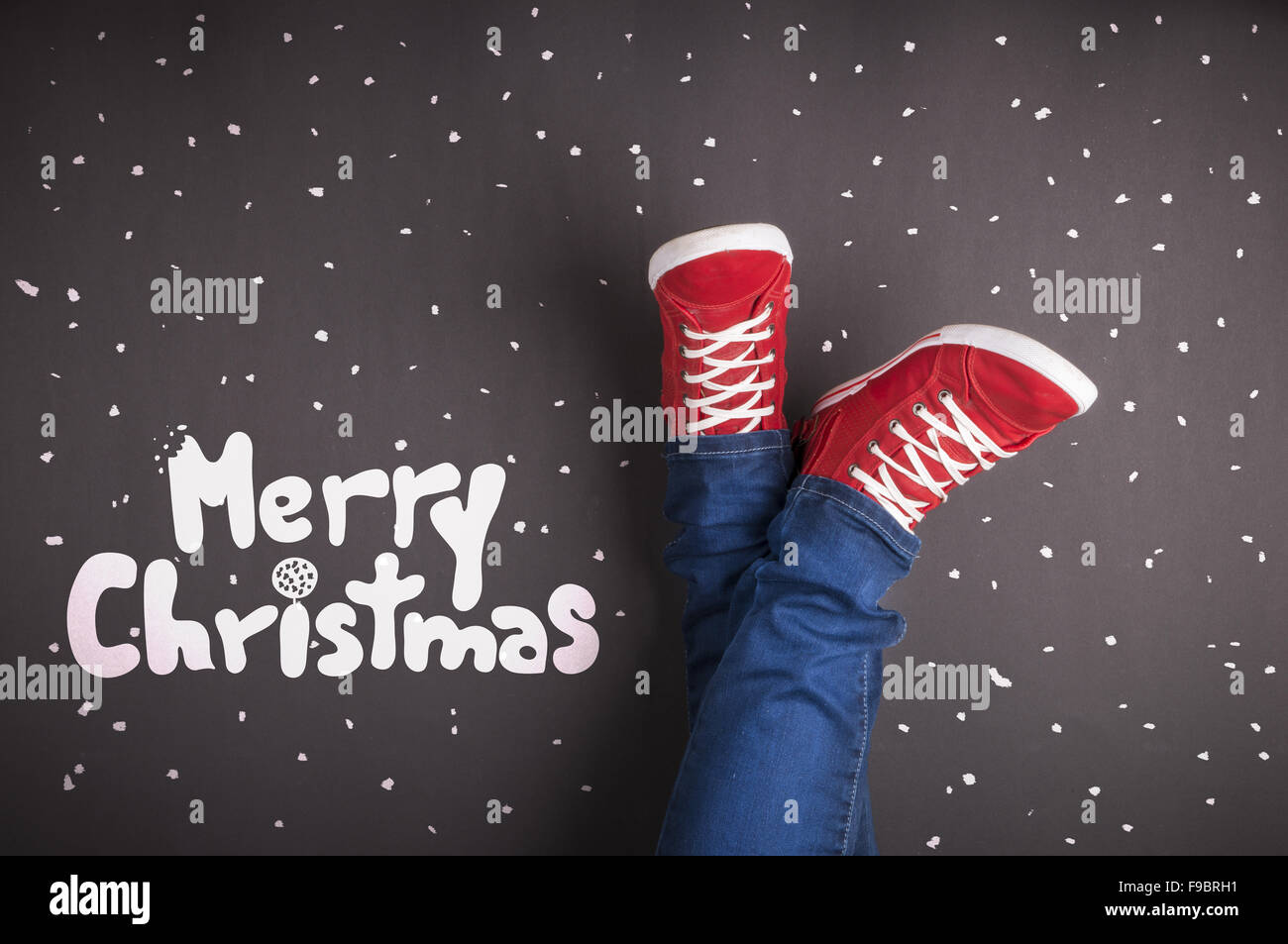 Christmas concept with red shoes and white chalk Stock Photo