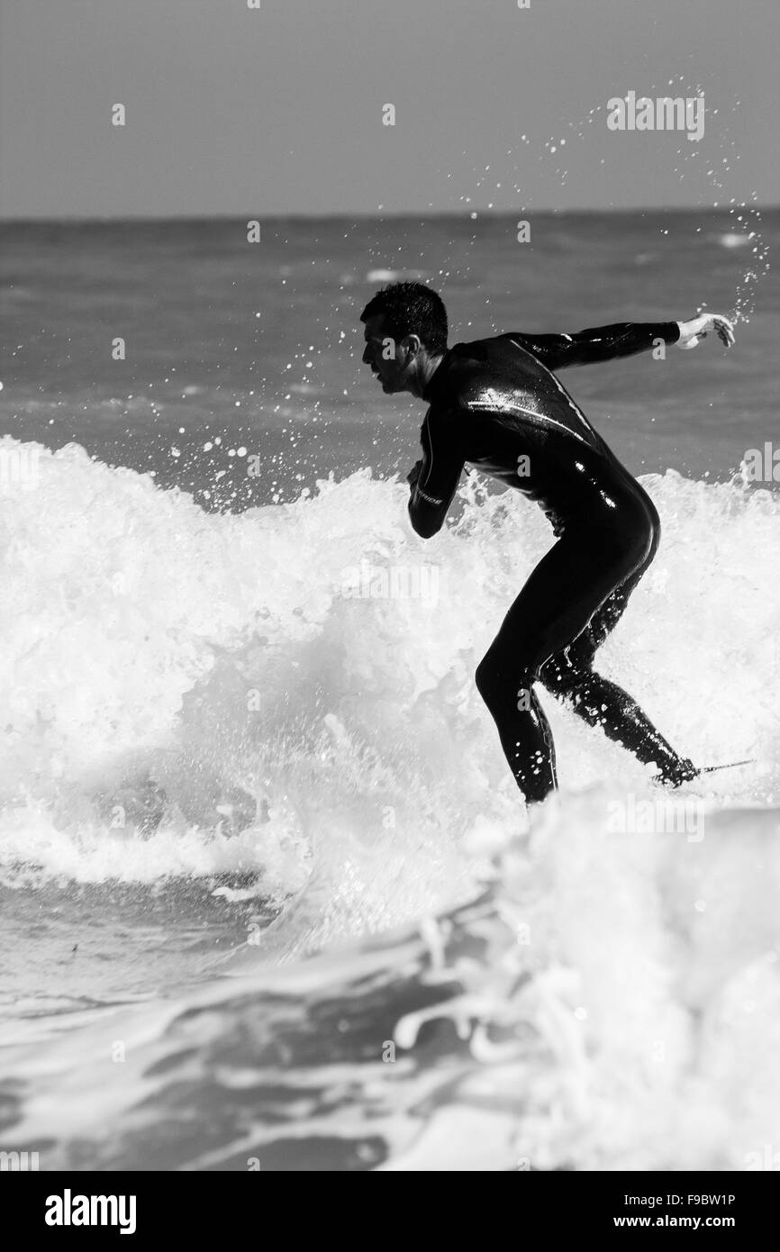 2015 .surfing .broadstairs. wet suit, long board, green, sea, east facing , low tide  ,hot swell ,man, suffer ,surf ,wave ,water Stock Photo
