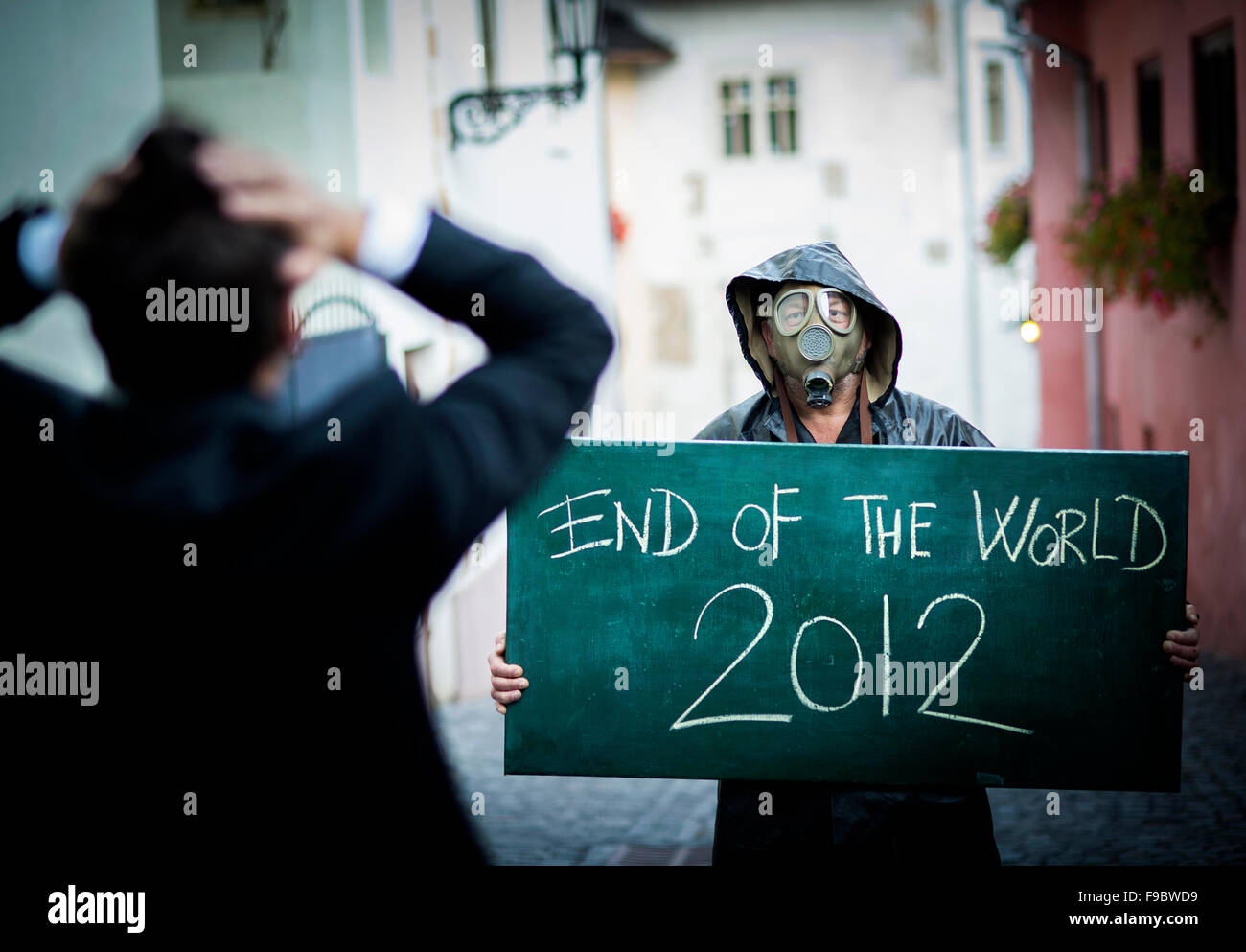 Business man is scared of the end of the world Stock Photo