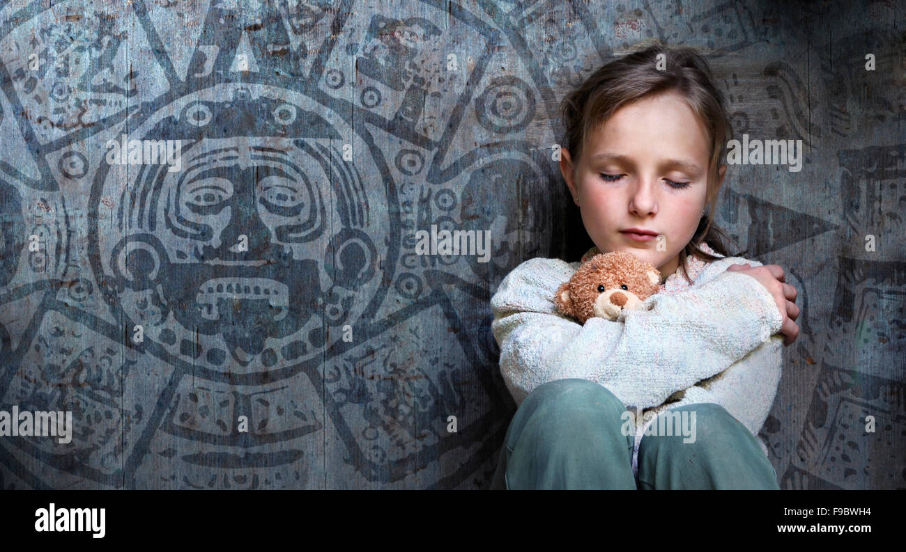 Frightened child with date of end of the world. Stock Photo