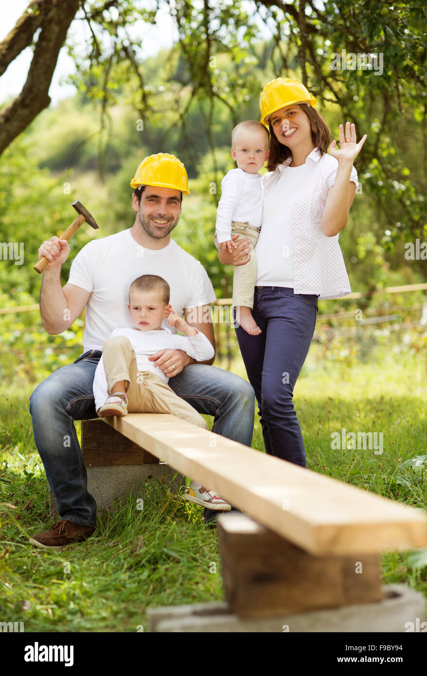 Young family is doing a building work together Stock Photo