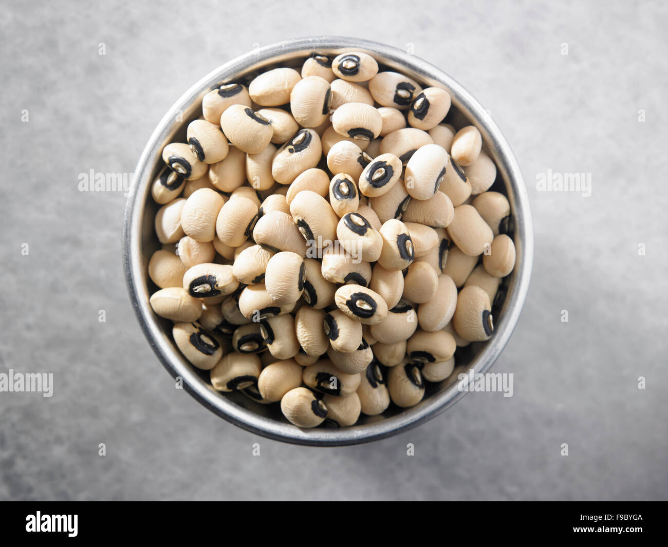 black eyed peas in a silver saucer Stock Photo