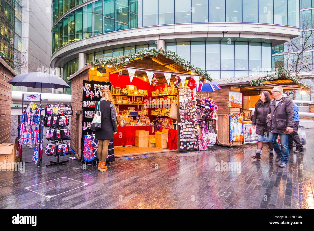 Stall with souvenirs of London at London Bridge City Christmas Market, Southwark, London SE1, on a wet day Stock Photo