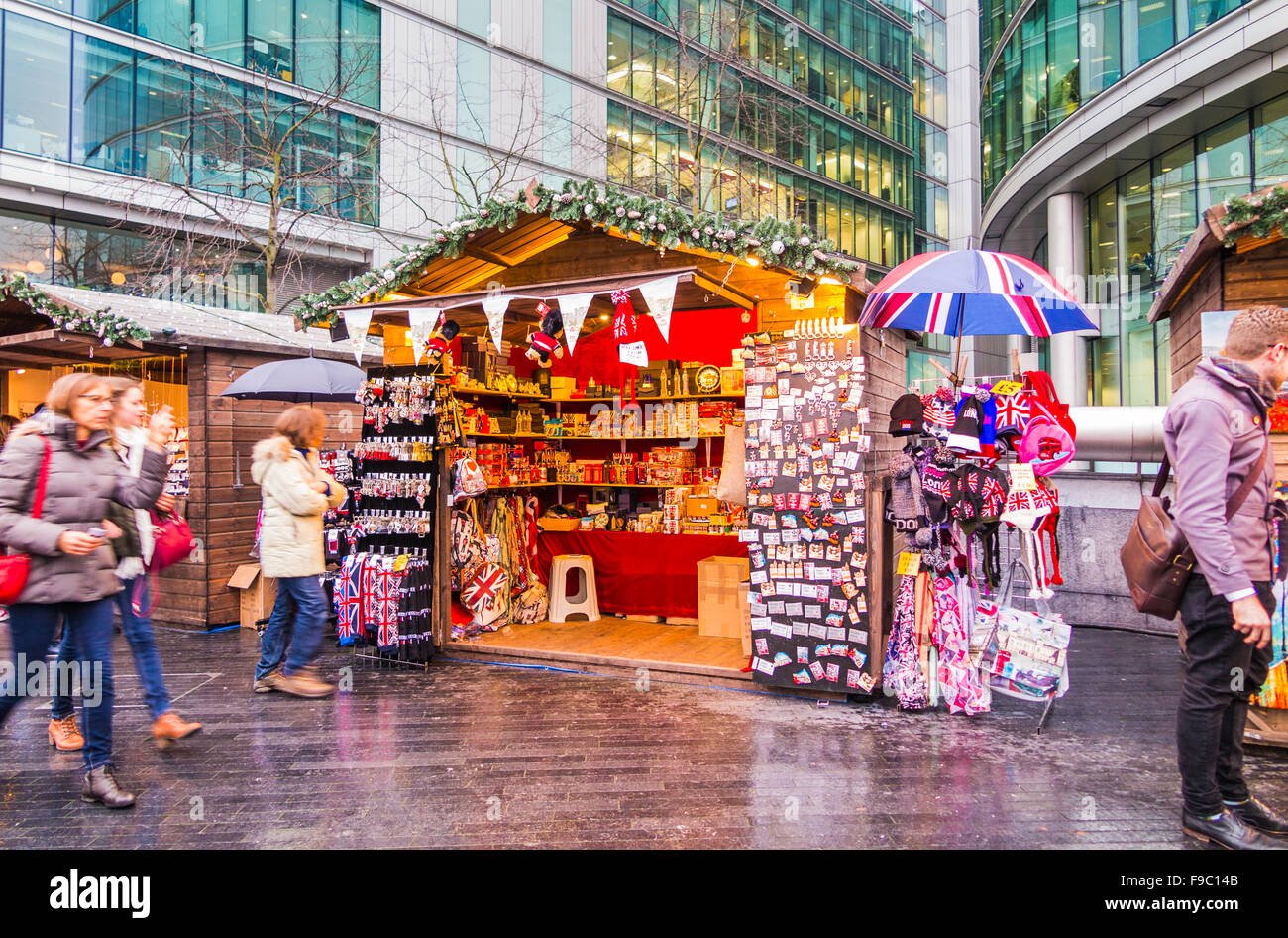 Stall with souvenirs of London at London Bridge City Christmas Market, Southwark, London SE1, on a wet day Stock Photo