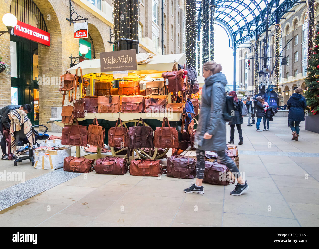 Stall selling leather handbags and satchels in the indoor Christmas market stalls in Hays Galleria, More London, Southwark SE1 Stock Photo
