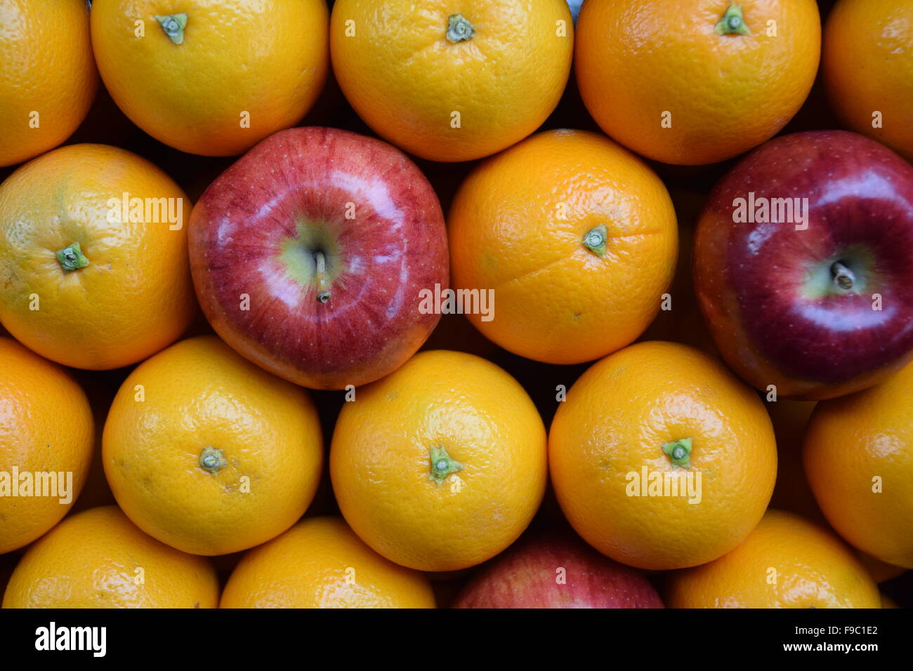 Comparing apples to oranges Stock Photo Alamy