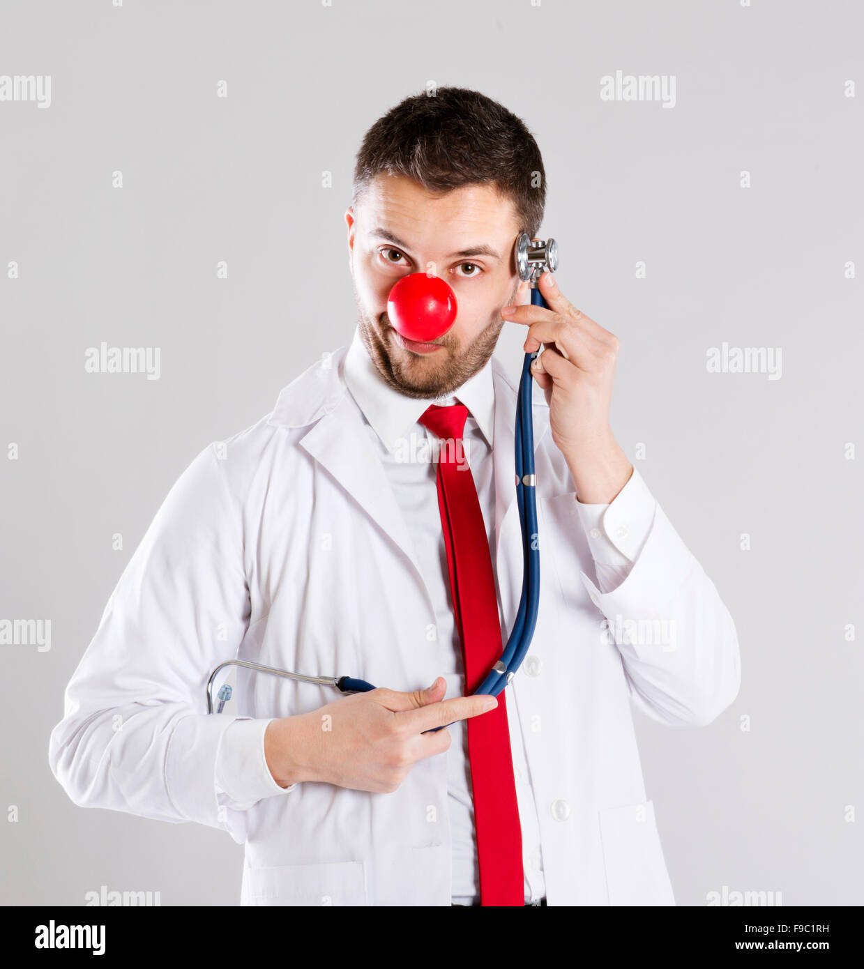 Portrait of funny doctor with red nose Stock Photo Alamy