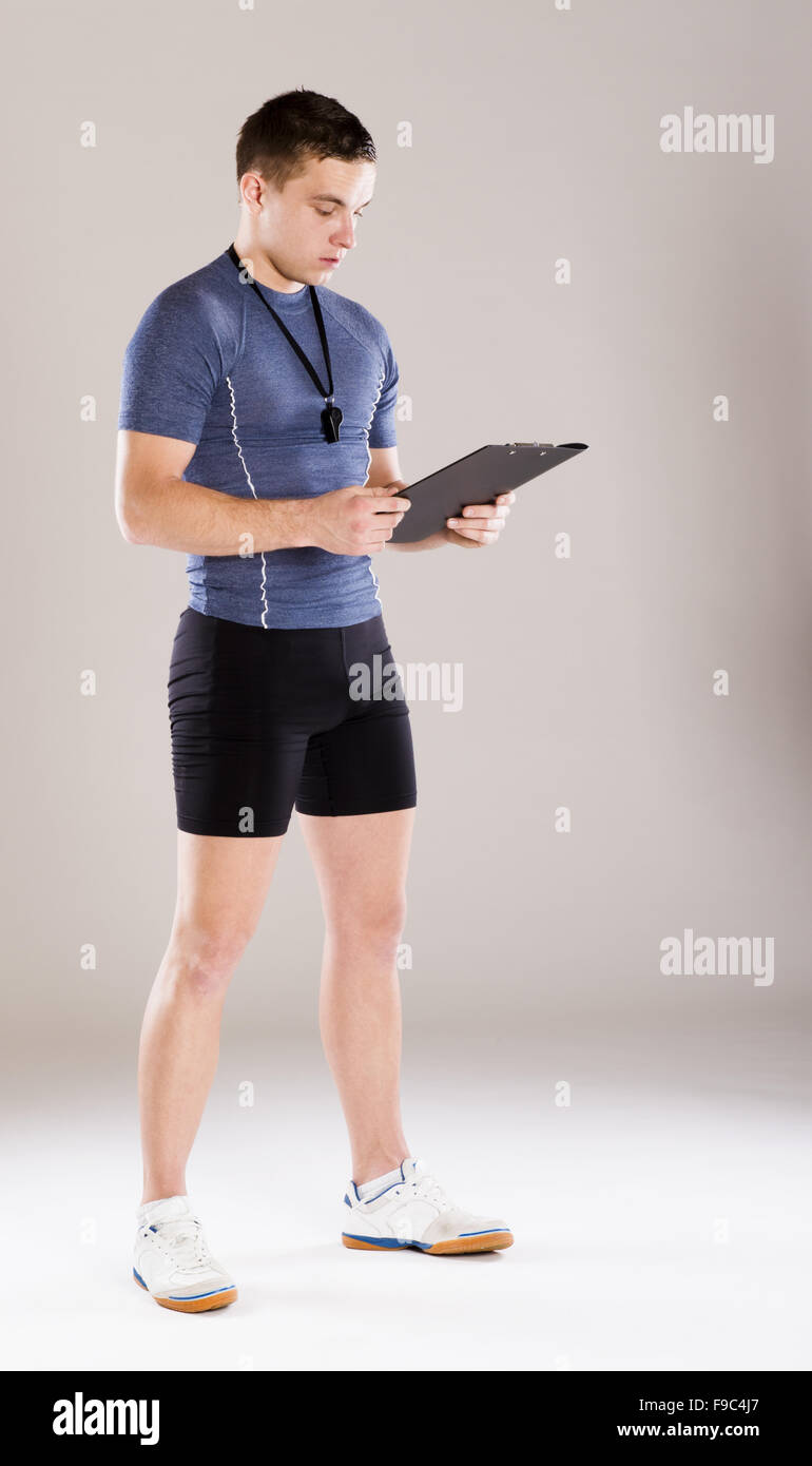 Young professional fitness coach standing in studio Stock Photo