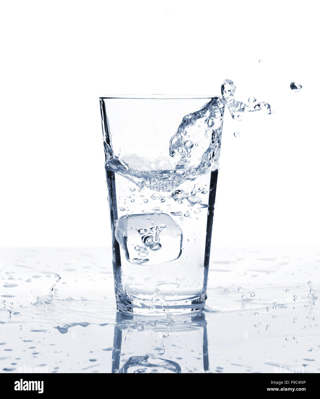 Glass of water with ice and splash. Isolated on white background Stock ...