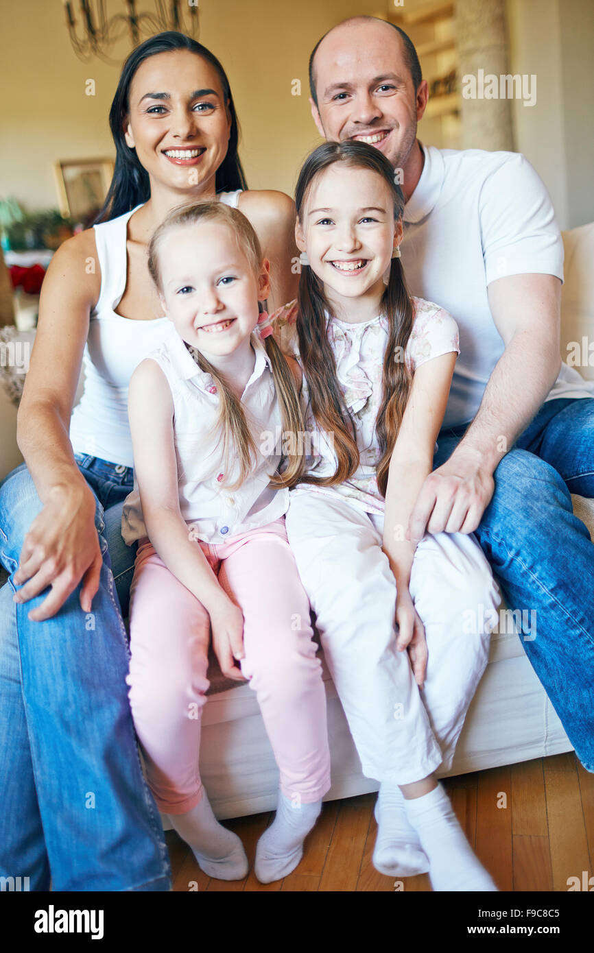 Family of four smiling at camera hi-res stock photography and images ...