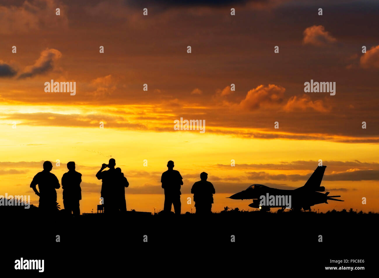 Sunset landing in Natal, Brazil, for this Chilean Air Force F-16 Fighting Falcon. Stock Photo