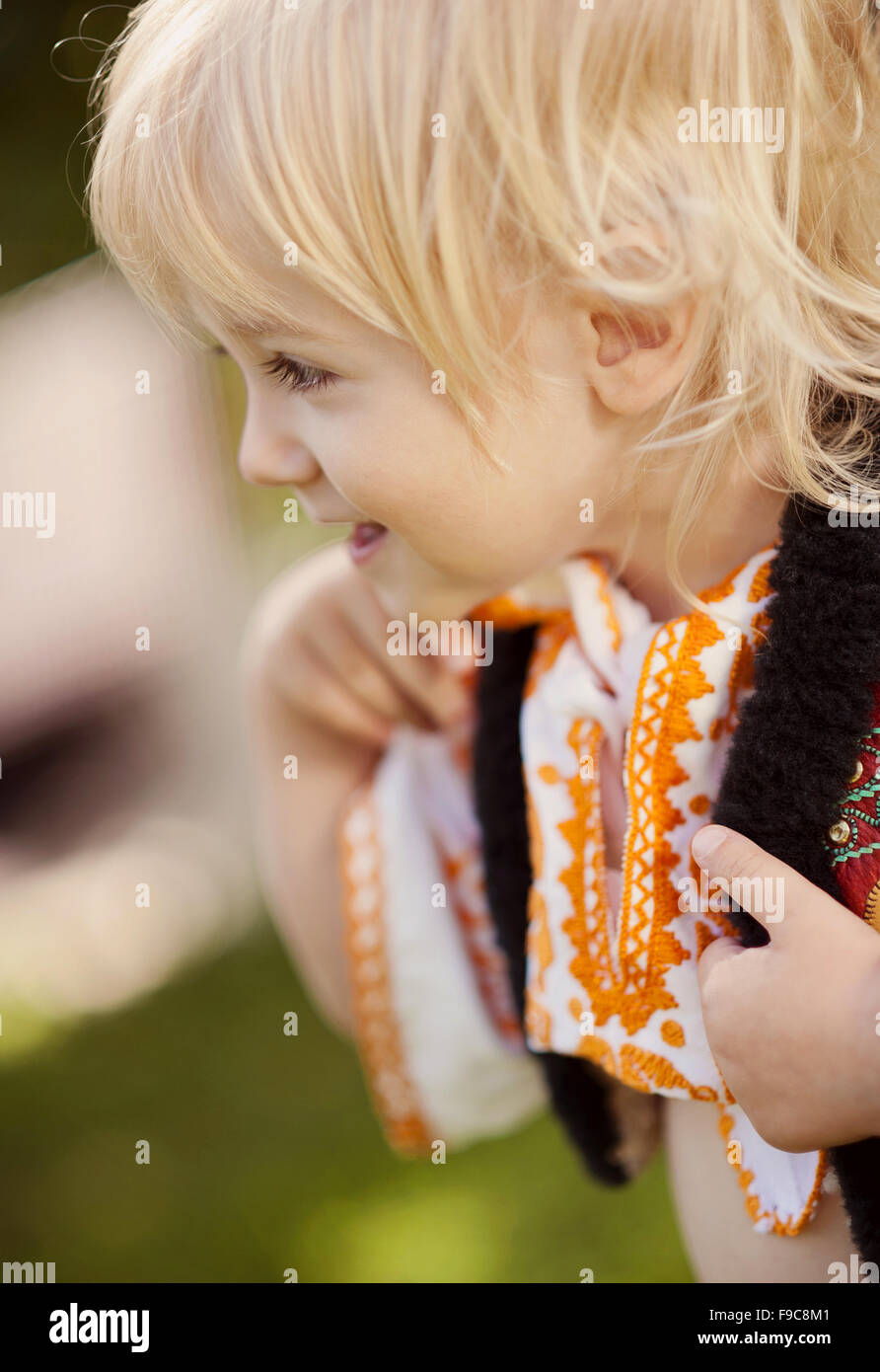 Cute child in folk costume from Easten Europe. Stock Photo