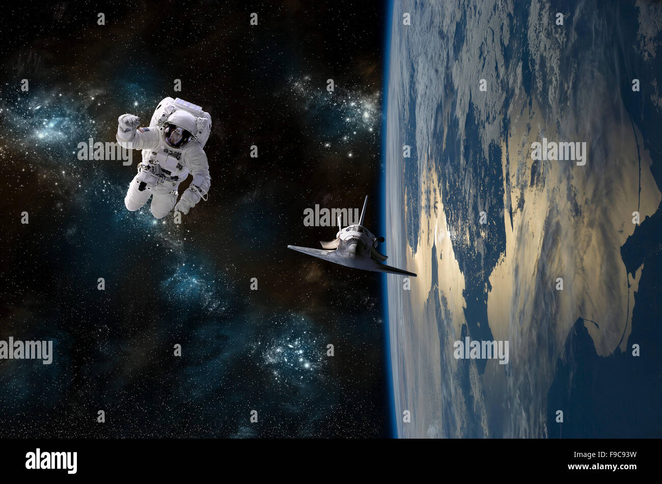 An astronaut drifting in space is rescued by a space shuttle orbiting Earth. Stock Photo