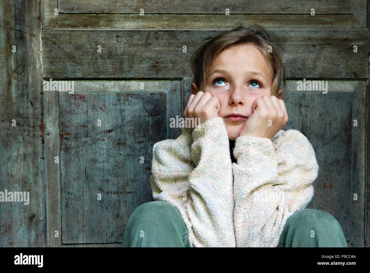 Sad little girl feels lonely. Stock Photo