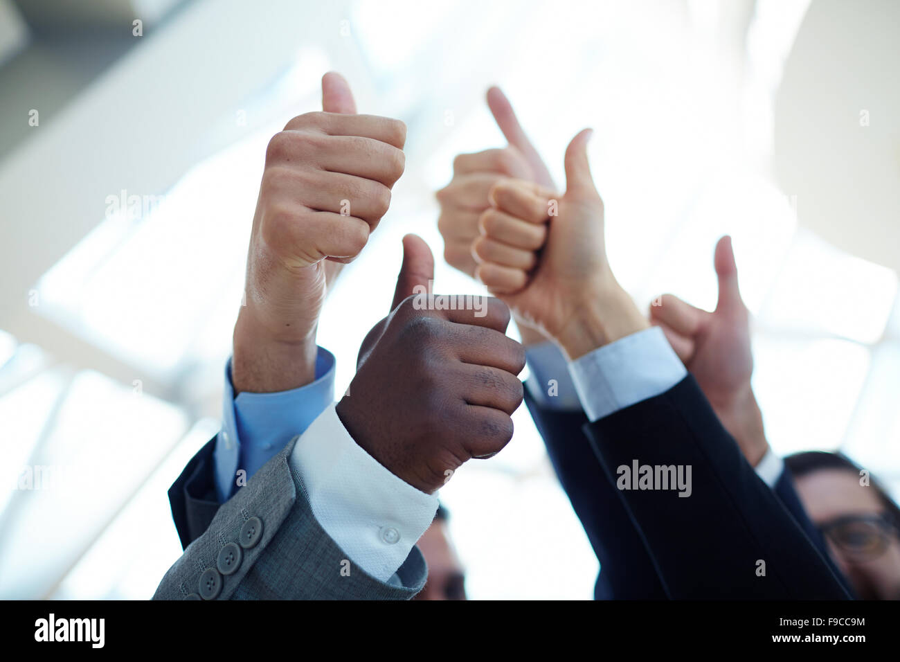 Business team raise hand hi-res stock photography and images - Alamy