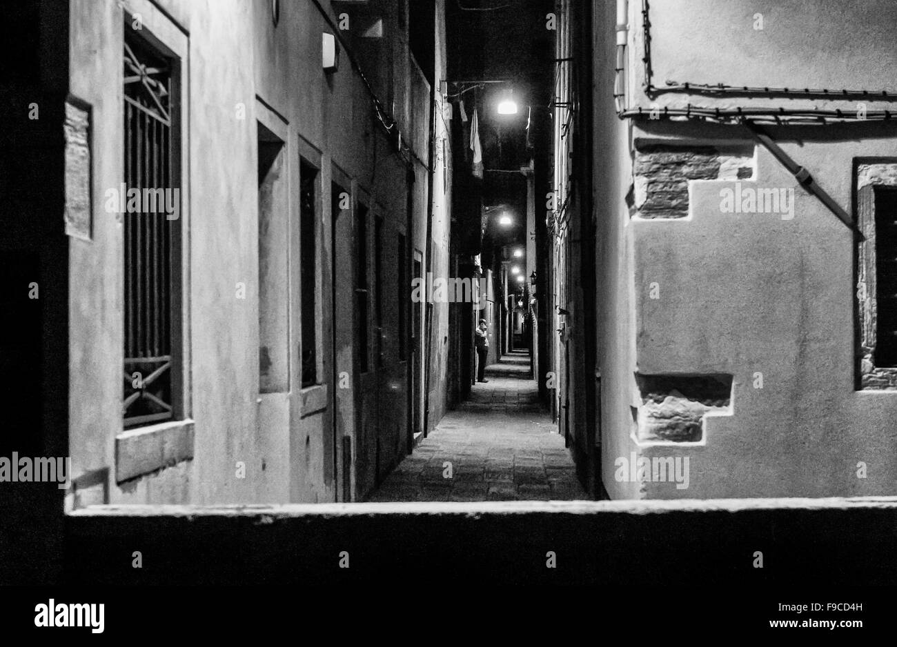 narrow street at night in Venice Stock Photo