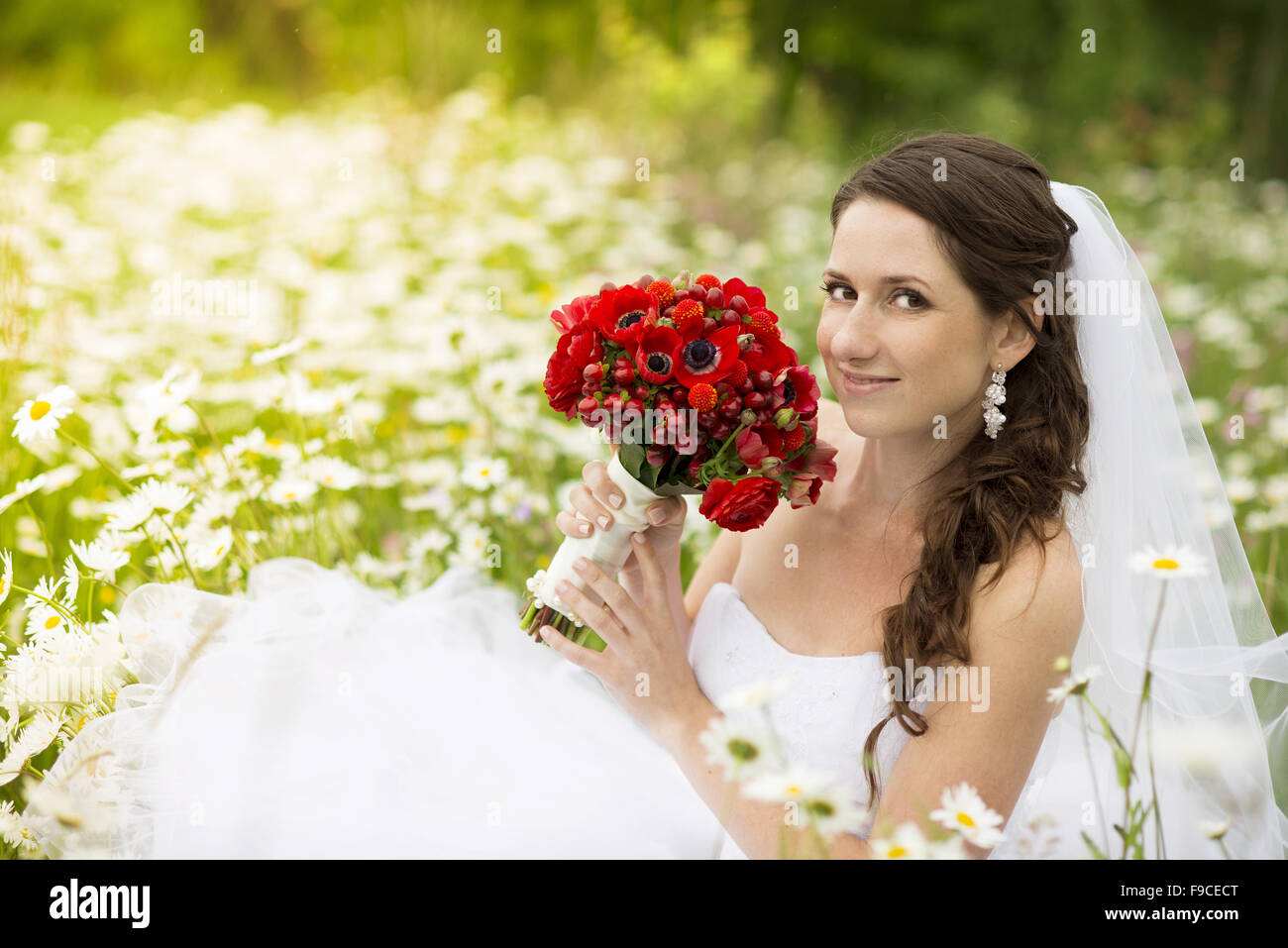 Bride in white wedding dress at the meadow Stock Photo - Alamy