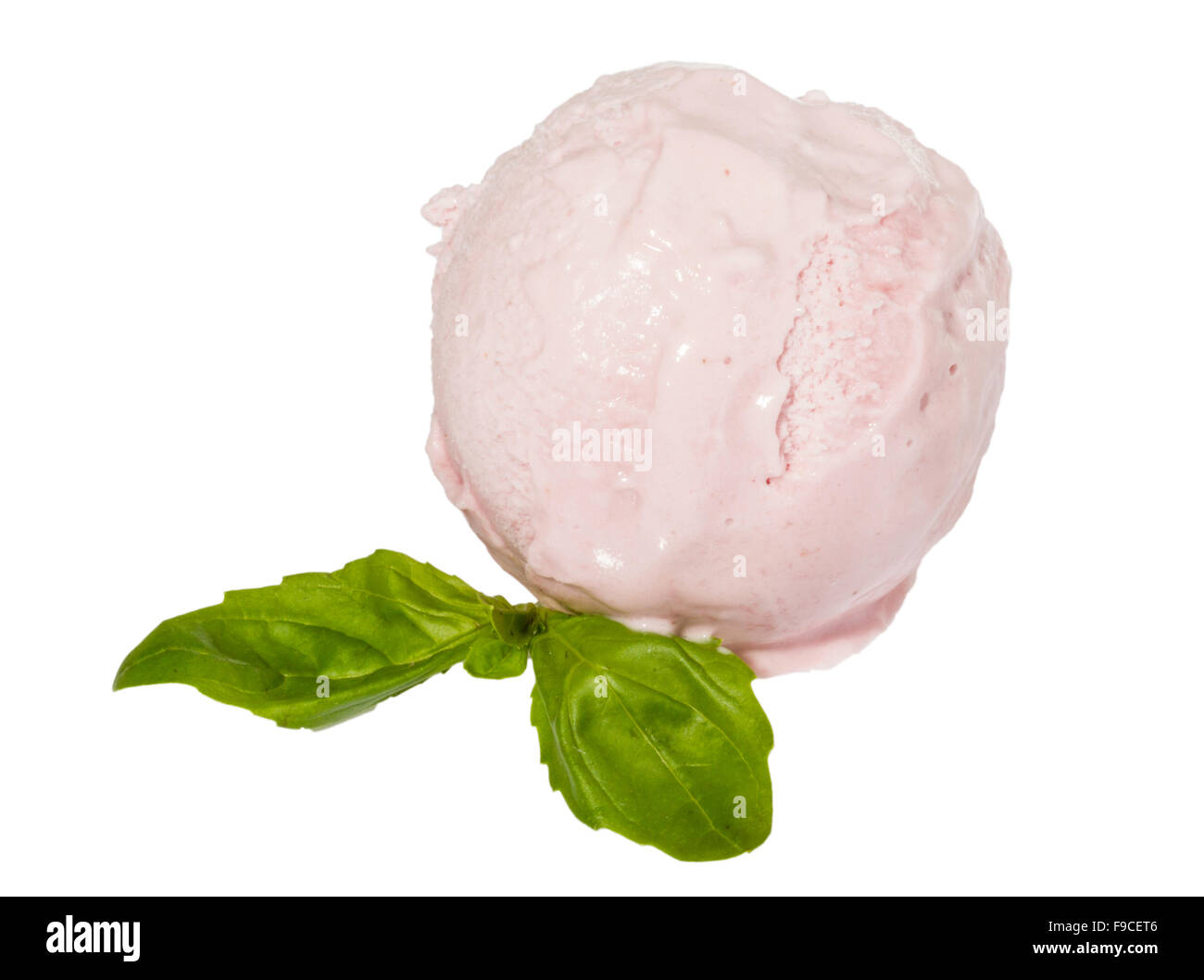 Scoop of strawberry ice cream from top on white background with mint ...