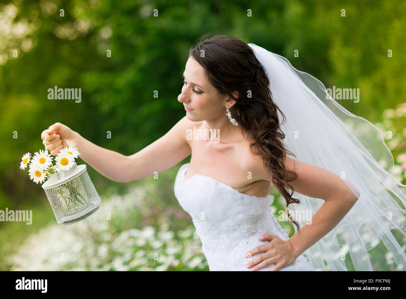 Bride in white wedding dress at the meadow Stock Photo - Alamy