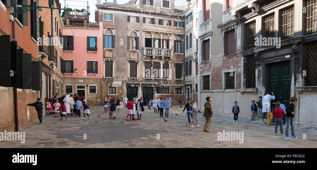 Kids playing in a little square in Venice Stock Photo