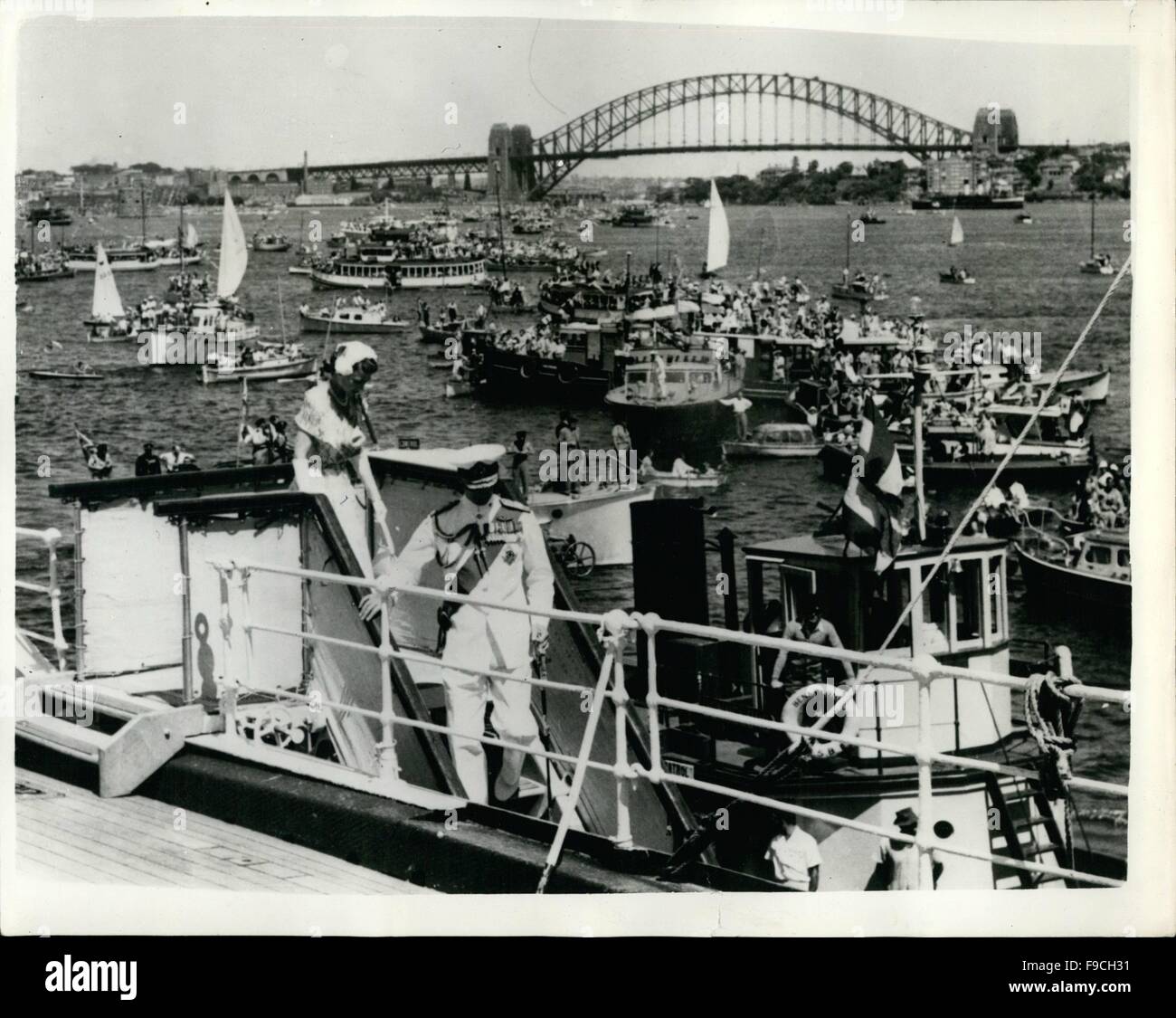 1964 - Queen And The Duke Of Edinburgh Arrive In Australia. Boats In The Harbour: A million Australians gathered in Sydney, Australia - today to greet H.M. The Queen and the Duke of Edinburgh when they arrived aboard the liner Gothic from New Zealand. They were met on the quayside by Field Marsgal Sir William Slim the Givernor General of Australia. Photo Shows: The Queen precedes the Duke Of Edinburgh who wears uniform of Admiral of the Fleet - as they step down the gangway of the liner Gothic on arrival in Sydney Harbour. Section of the famous Sydney Harbour Bridge can be see in the backgro Stock Photo
