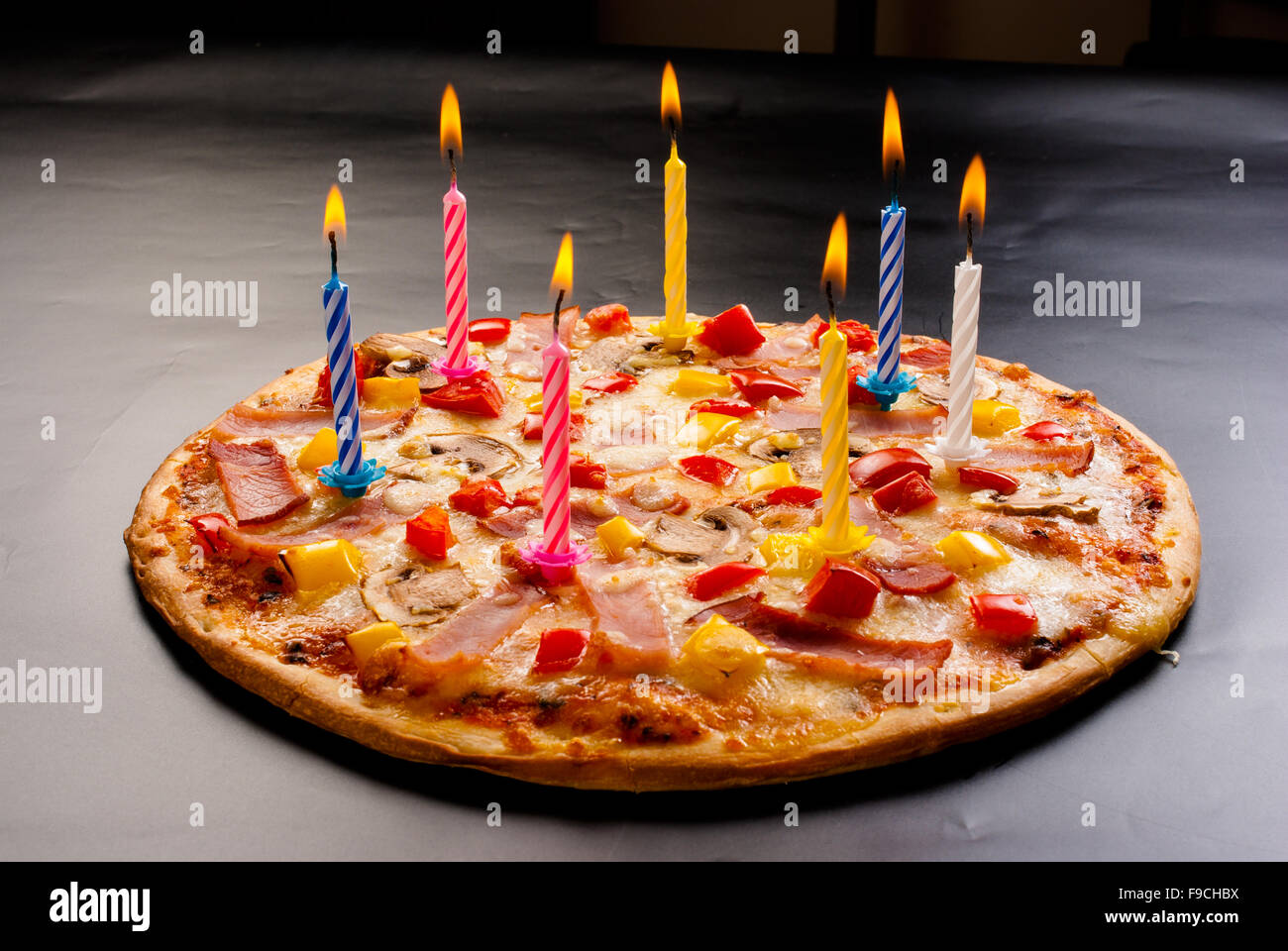 Festive candles pizza with mushrooms, cauliflower, olives, cheese and sweet pepper Stock Photo
