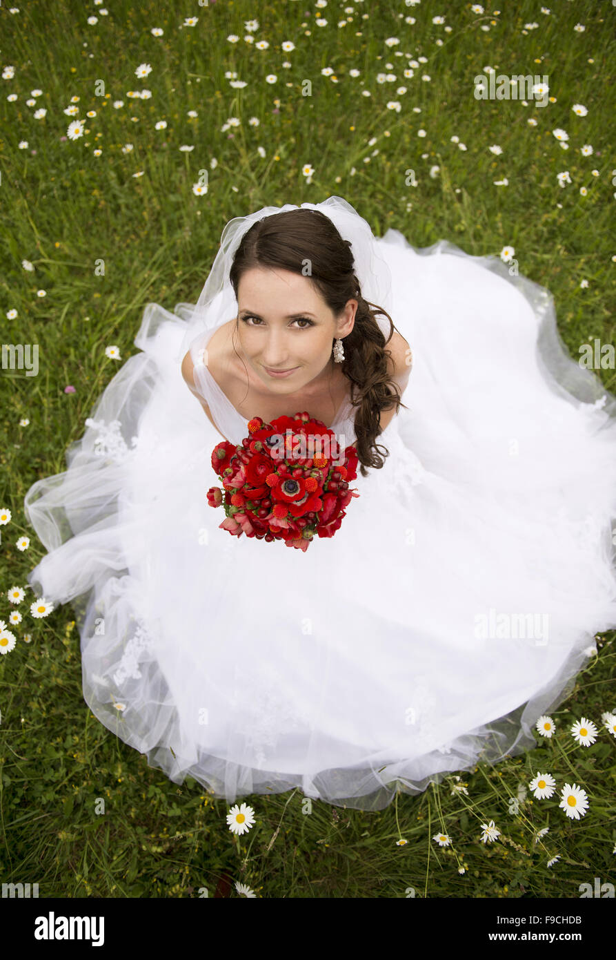 Bride in white wedding dress at the meadow Stock Photo - Alamy